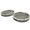 Round black and white bone inlay serving trays in geometric pattern