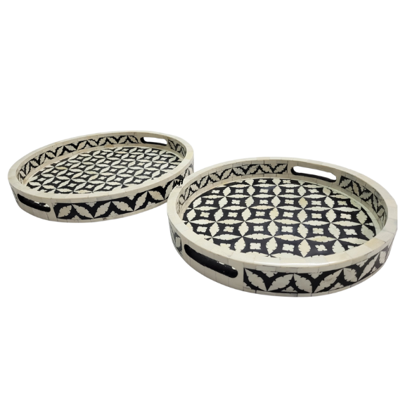 Round black and white bone inlay serving trays in geometric pattern
