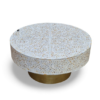 Round mother of pearl coffee table with white floral inlay pattern and brass base