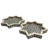 bone-inlay-black-white-star-trays-set-of-2 Set of two black and white star-shaped bone inlay trays in geometric pattern