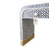 Black and white bone inlay waterfall nightstand with geometric leaf pattern and brass base Bone Inlay Bedside Table | Black Nightstand