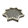 bone-inlay-black-white-star-trays-set-of-2 Set of two black and white star-shaped bone inlay trays in geometric pattern