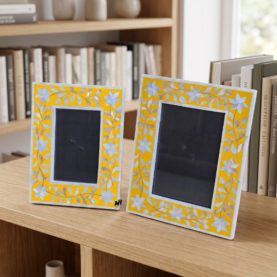 Set of two yellow mother of pearl inlay picture frames in floral pattern