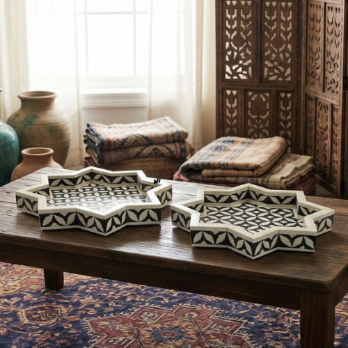 bone-inlay-black-white-star-trays-set-of-2 Set of two black and white star-shaped bone inlay trays in geometric pattern